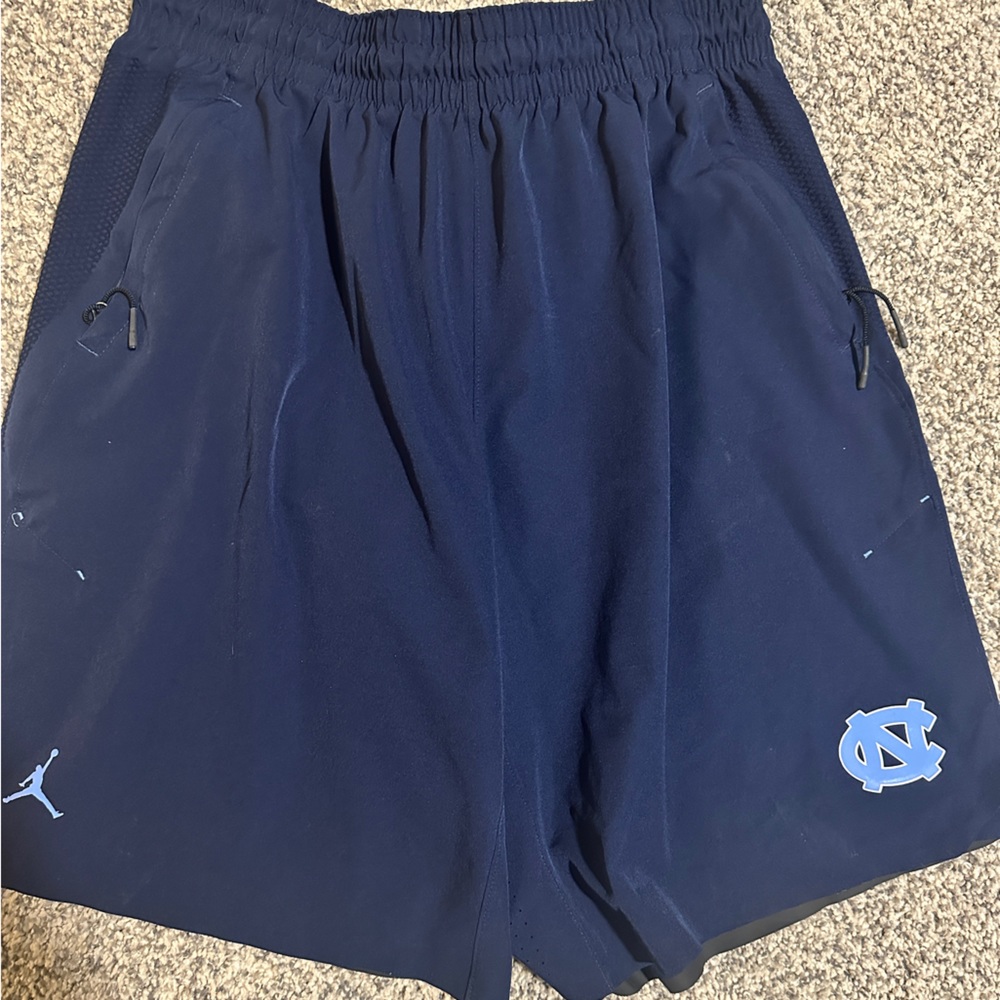 UNC team issued performance shorts, Pockets with zippers.